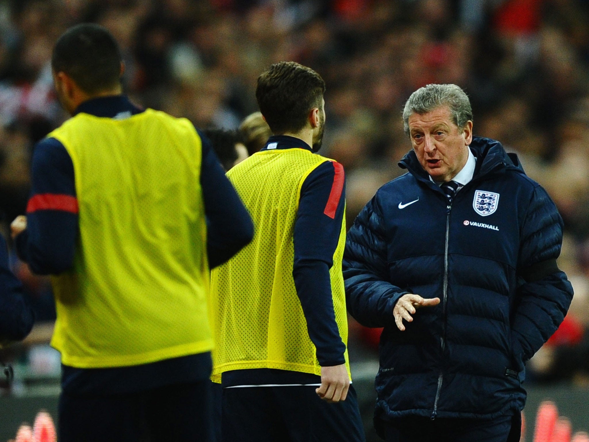 Roy Hodgson talks to his England team during the win over Denmark
