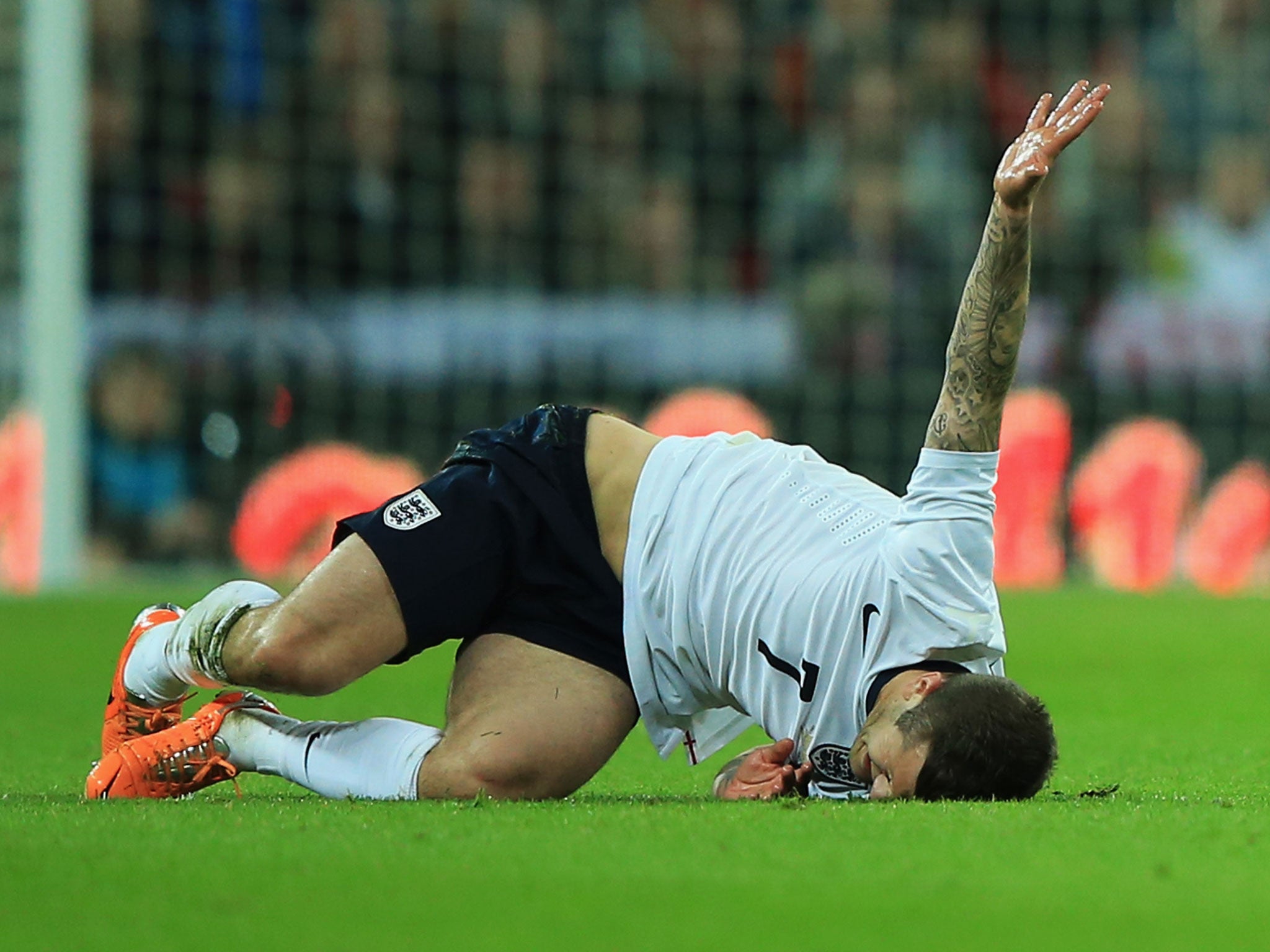 Jack Wilshere grimaces after Daniel Agger's tackle left him in agony in England's 1-0 friendly win over Denmark at Wembley