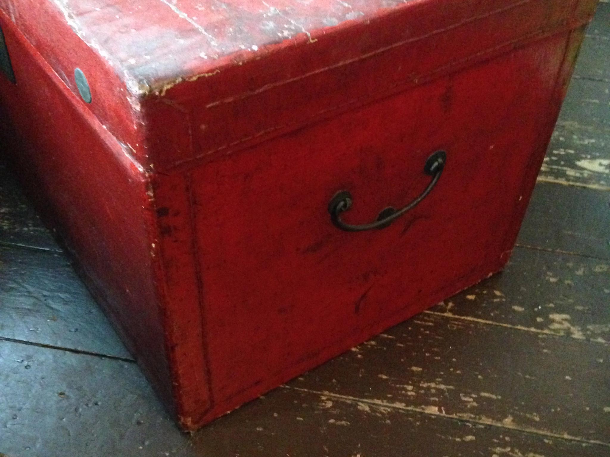 The red trunk in which Bill's ashes are stored