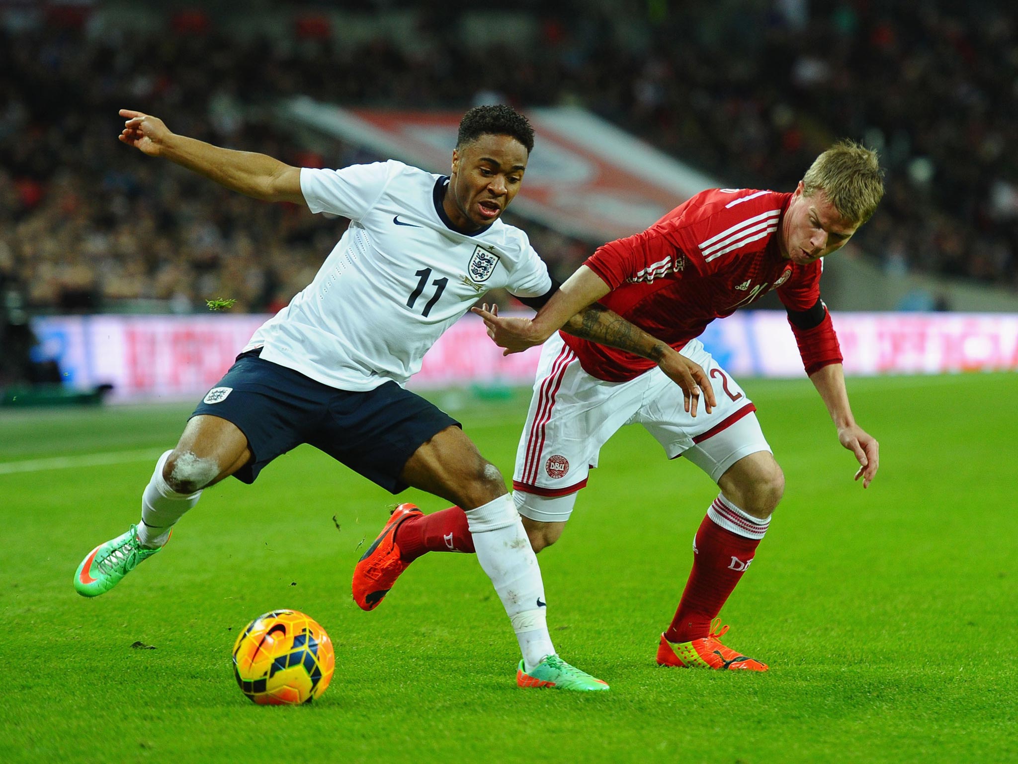Raheem Sterling battles for the ball and should be in the squad for Brazil