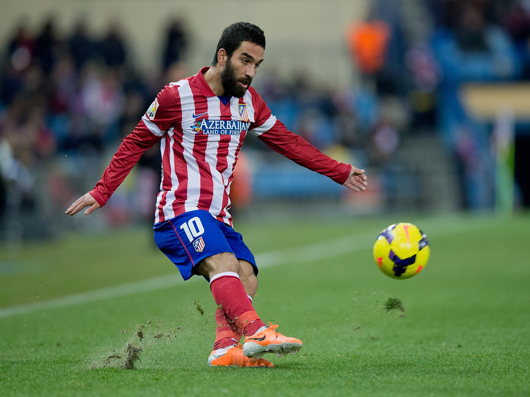 Arda Turan's agent has claimed that the Atletico Madrid winger wants to work under Arsene Wenger with Arsenal
