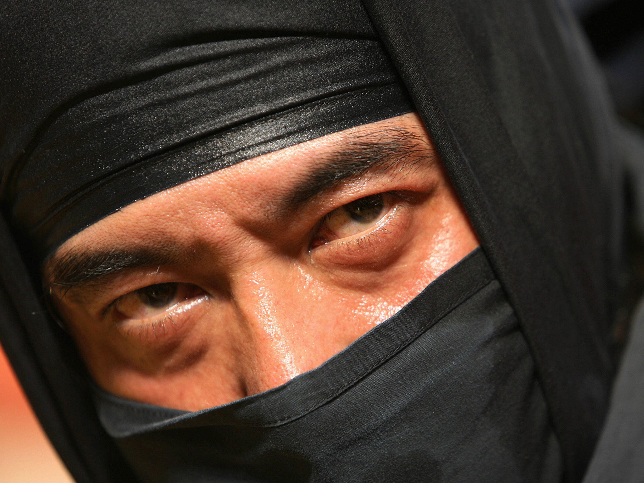 A Japanese Ninja poses after a performance at a cultural festival.