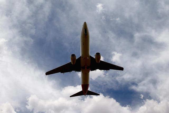 A man has been charged with endangering a flight after allegedly hitting an aircraft window and causing it to crack as it travelled approximately 35,000 feet in the air.
