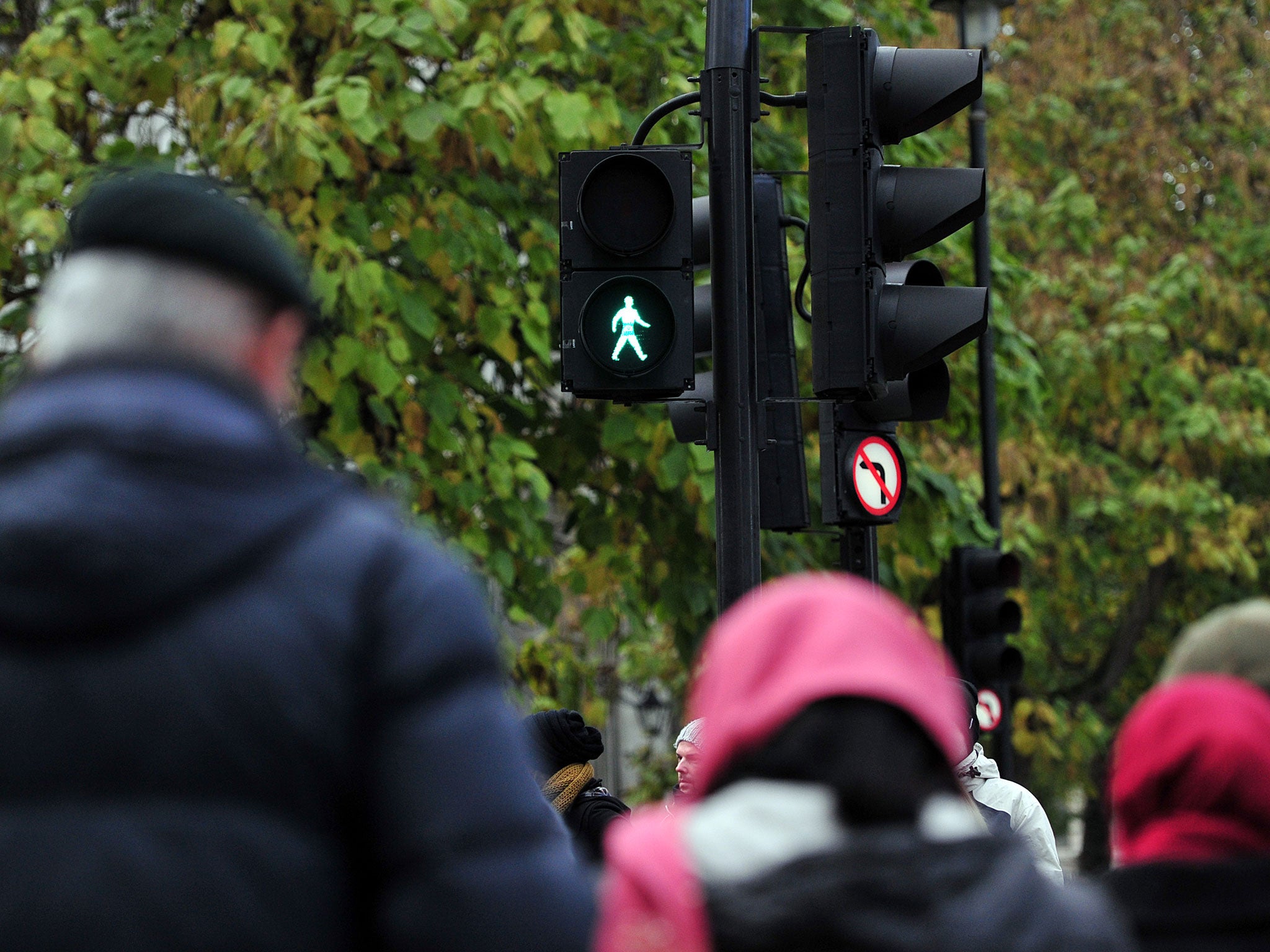 A 'green man' is pictured at a pedestrian crossing in central London.