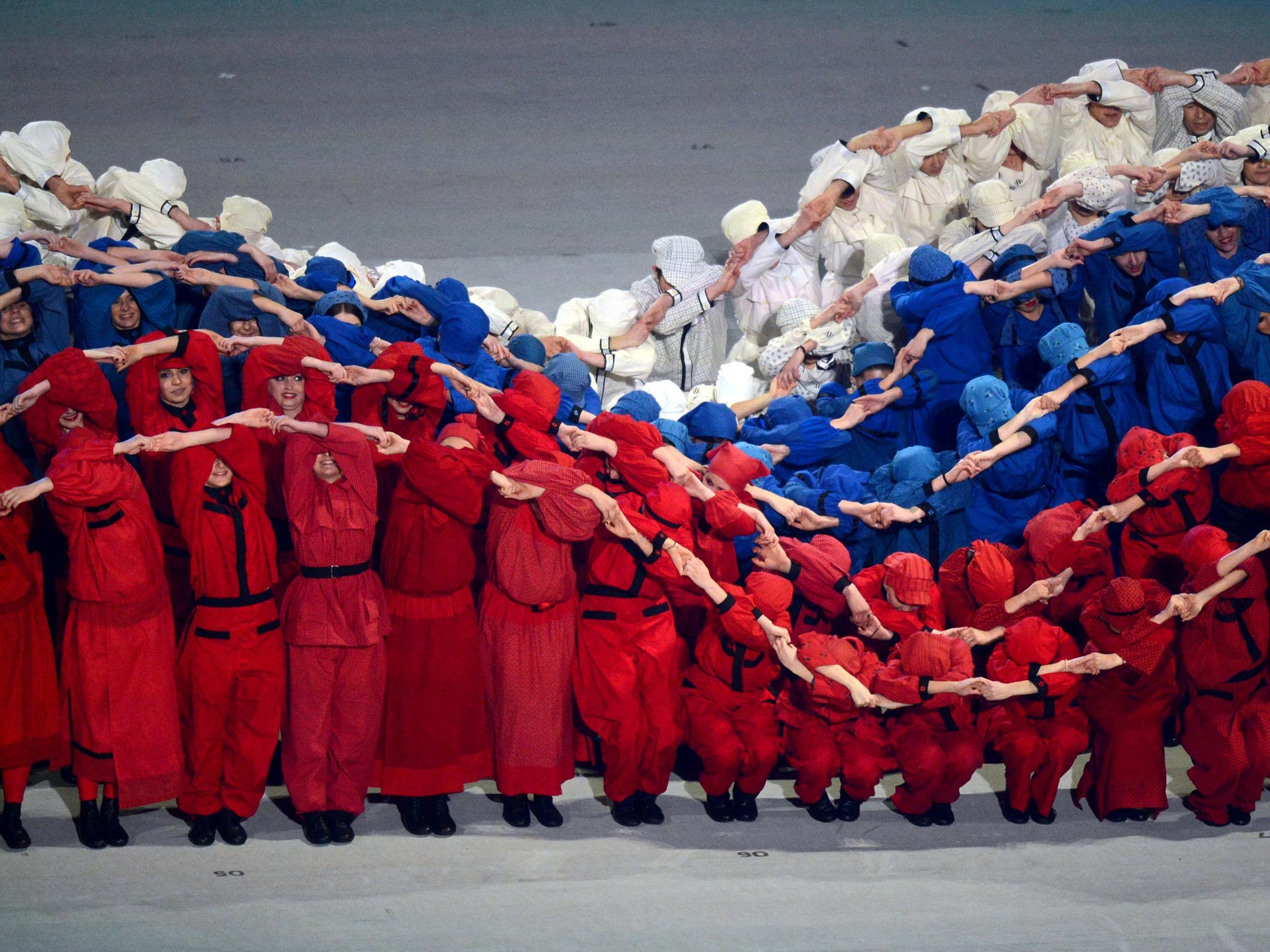 Performers simulate the Russian flag moving in the wind during the
opening ceremony of the Paralympic Winter Games