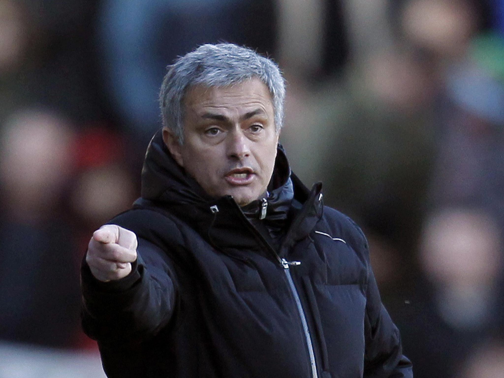 Jose Mourinho makes a gesture form the touchline