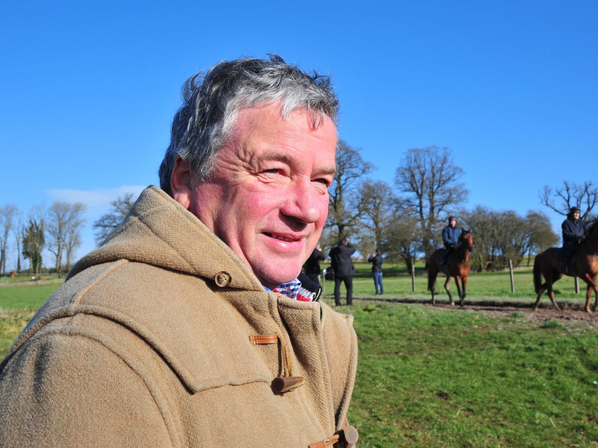 Nigel Twiston-Davies watches his horses ride out at Grange Hill Farm
