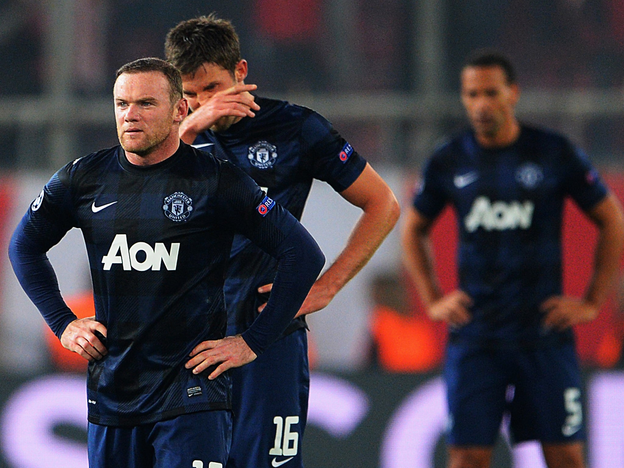 Wayne Rooney and Michael Carrick look dejected after defeat to Olympiakos.