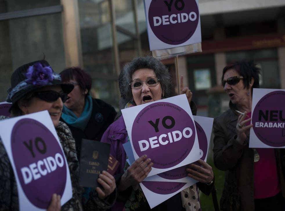 Women carry placards saying ‘I decide’ during the protests 