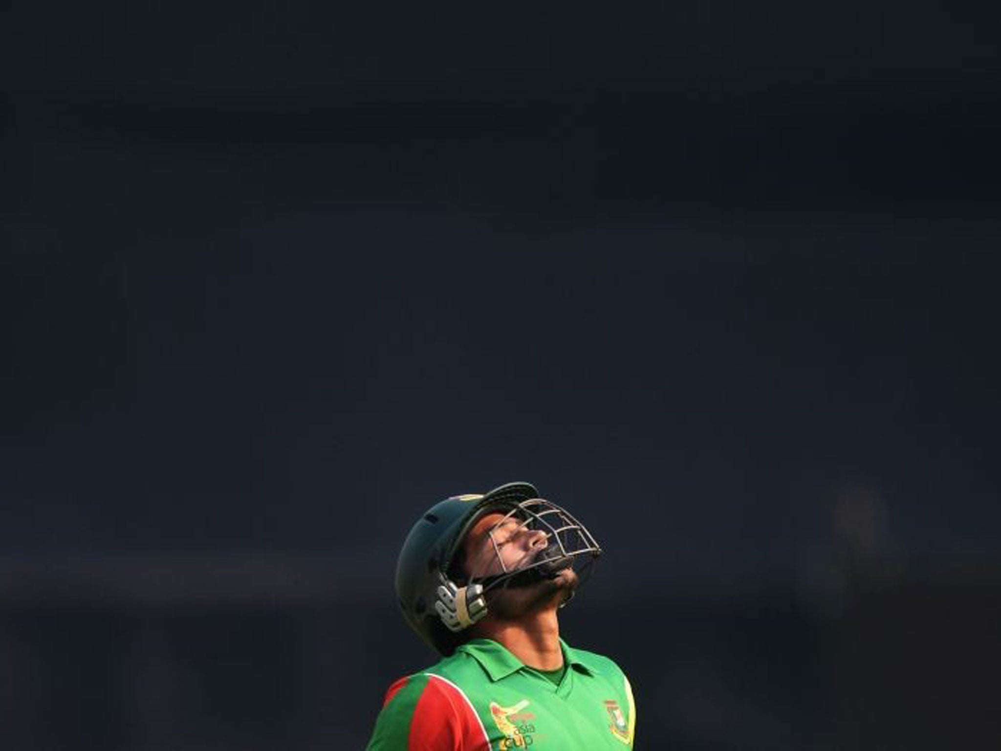 Bangladeshi captain Mushfiqur Rahim reacts as he walks back to the dressing room after losing his wicket
