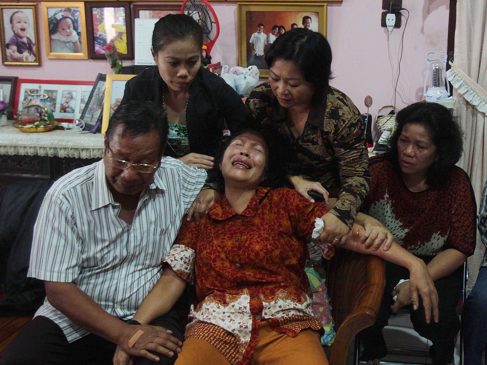 The parents of Firman Chandra Siregar, one of the passengers on flight MH370 in Medan, Indonesia