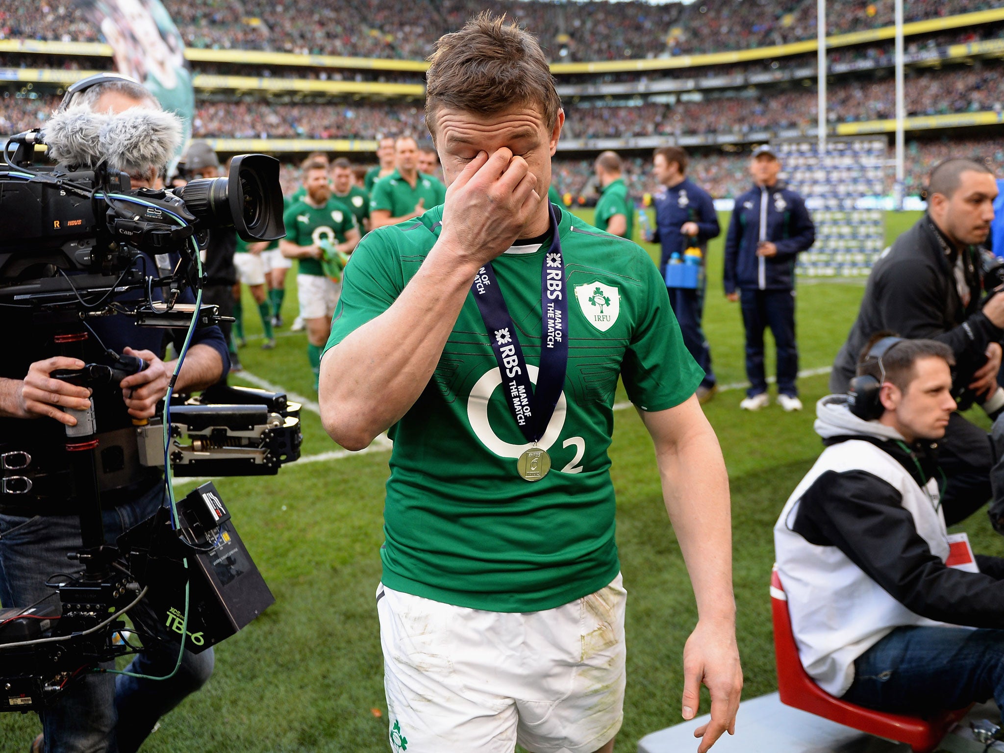 Brian O'Driscoll of Ireland shows his emotions as he walks from the field after his final home international after the Six Nations match between Ireland and Italy