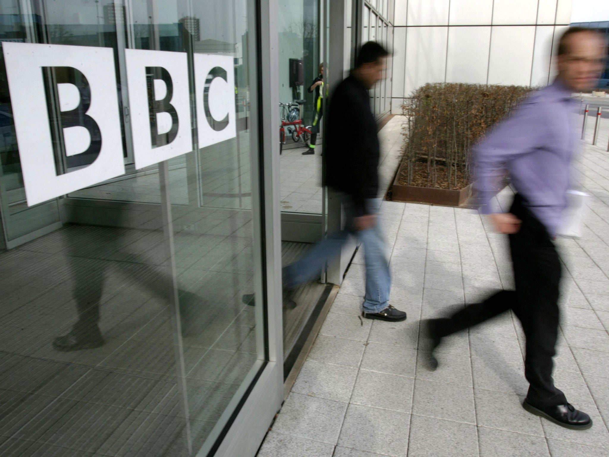 People leave the BBC building