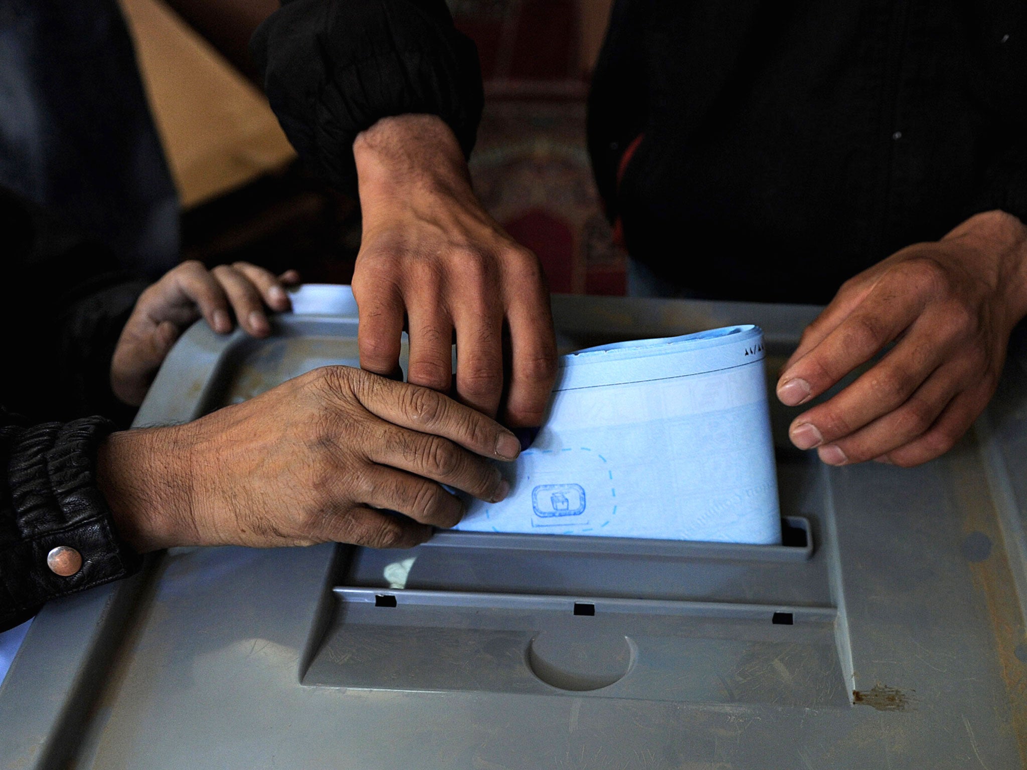 An Afghan man casts his vote at a polling station in Kabul in the 2010 parliamentary elections.