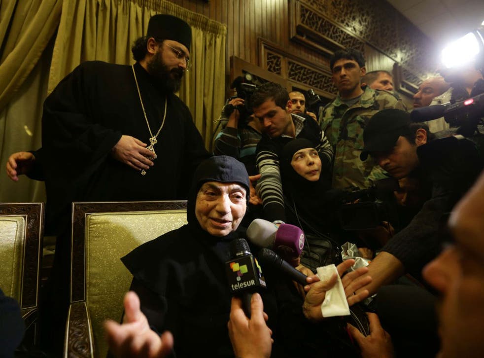 Kidnapped nuns talk to the media at Jdeidet Yabus on the Syrian side of the border with Lebanon after an arduous nine-hour journey yesterday