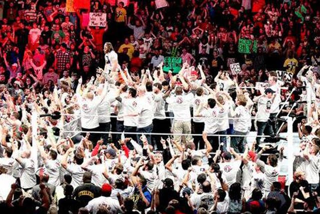 Daniel Bryan floods the ring with members of the Yes! Movement