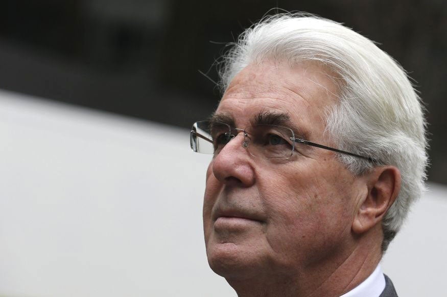 Publicist Max Clifford arrives at Southwark Crown Court in central London March 11, 2014. Clifford is on trial on 11 counts of indecent assault, and denies the charges.