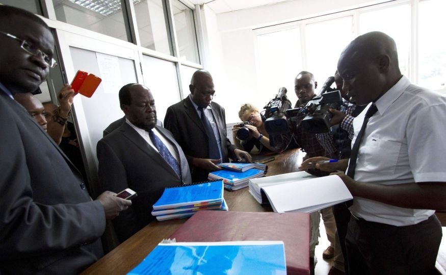 Gay and human rights activists (L) file a constitutional petition against a new anti-homosexuality law, at the courts in Uganda's capital Kampala 11 March, 2014.