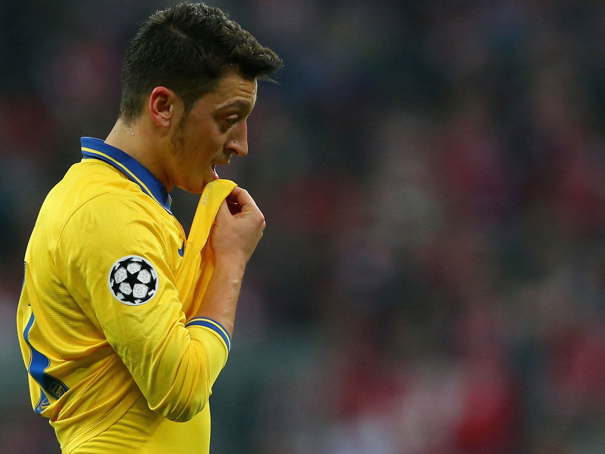 Mesut Ozil grimaces during the 1-1 draw at Bayern Munich on Tuesday