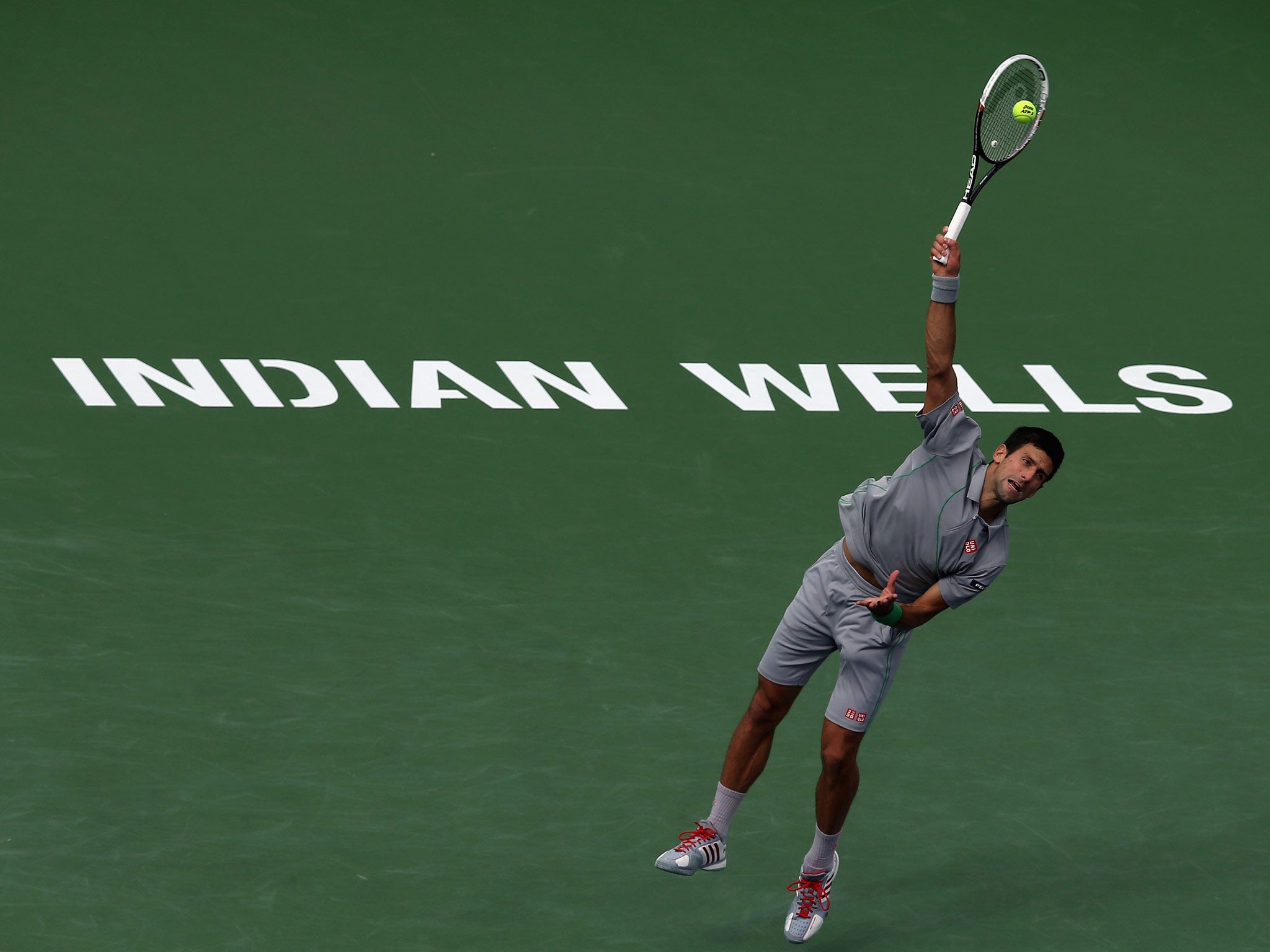 Novak Djokovic of Serbia serves to Alejandro Gonzalez of Colombia during the BNP Paribas Open at Indian Wells