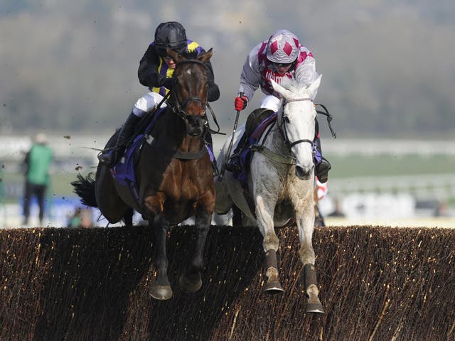 Barry Geraghty riding O'Faolains Boy (L) clear the last to win The RSA Steeple Chase from Smad Place (R) at Cheltenham 