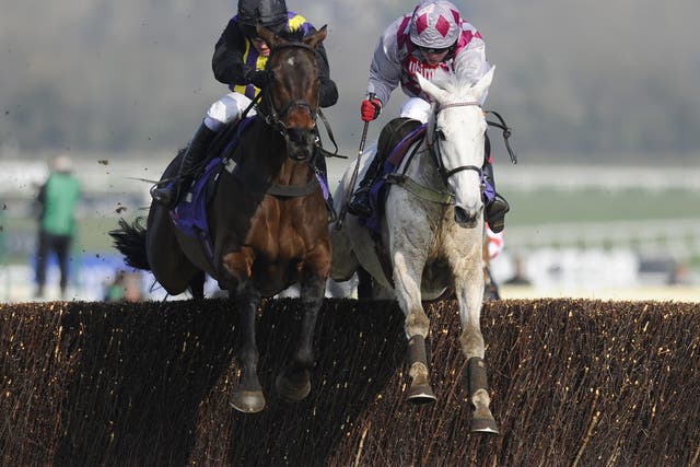 Barry Geraghty riding O'Faolains Boy (L) clear the last to win The RSA Steeple Chase from Smad Place (R) at Cheltenham 