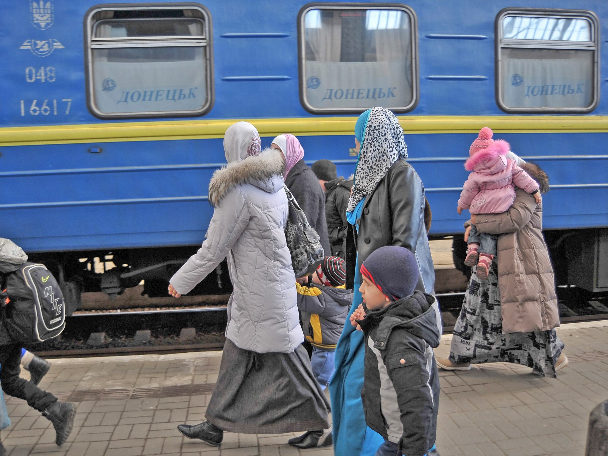 Crimean Tatar families arrive in Lviv, western Ukraine