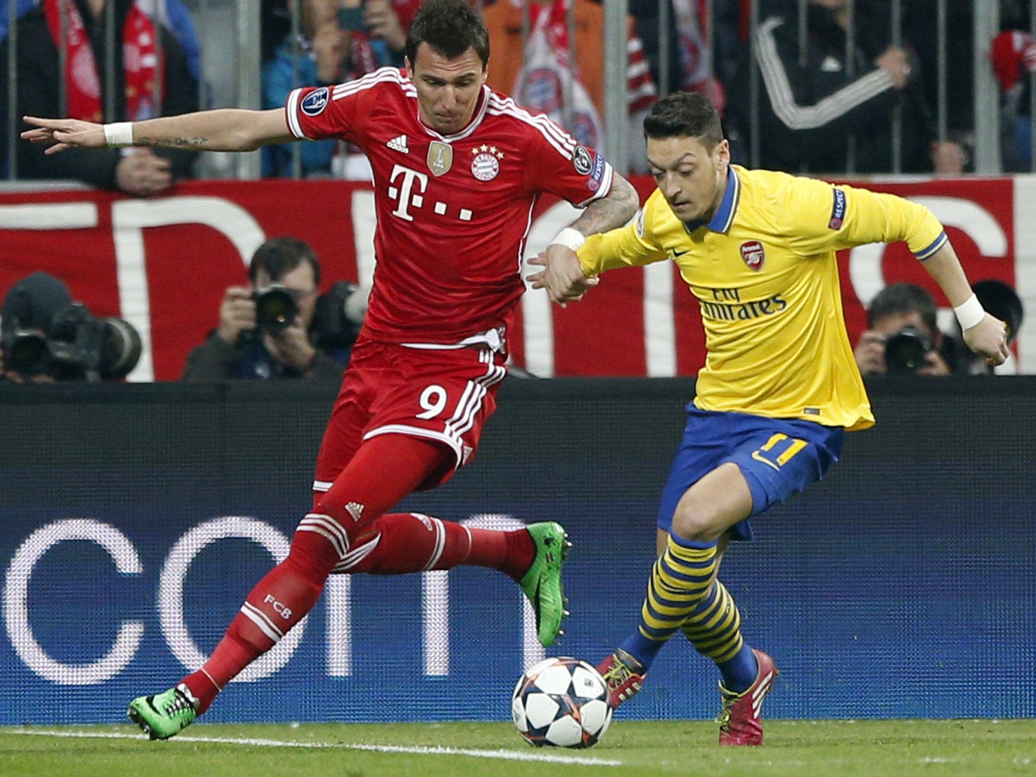 Mesut Özil (right) was injured against Bayern on Tuesday night