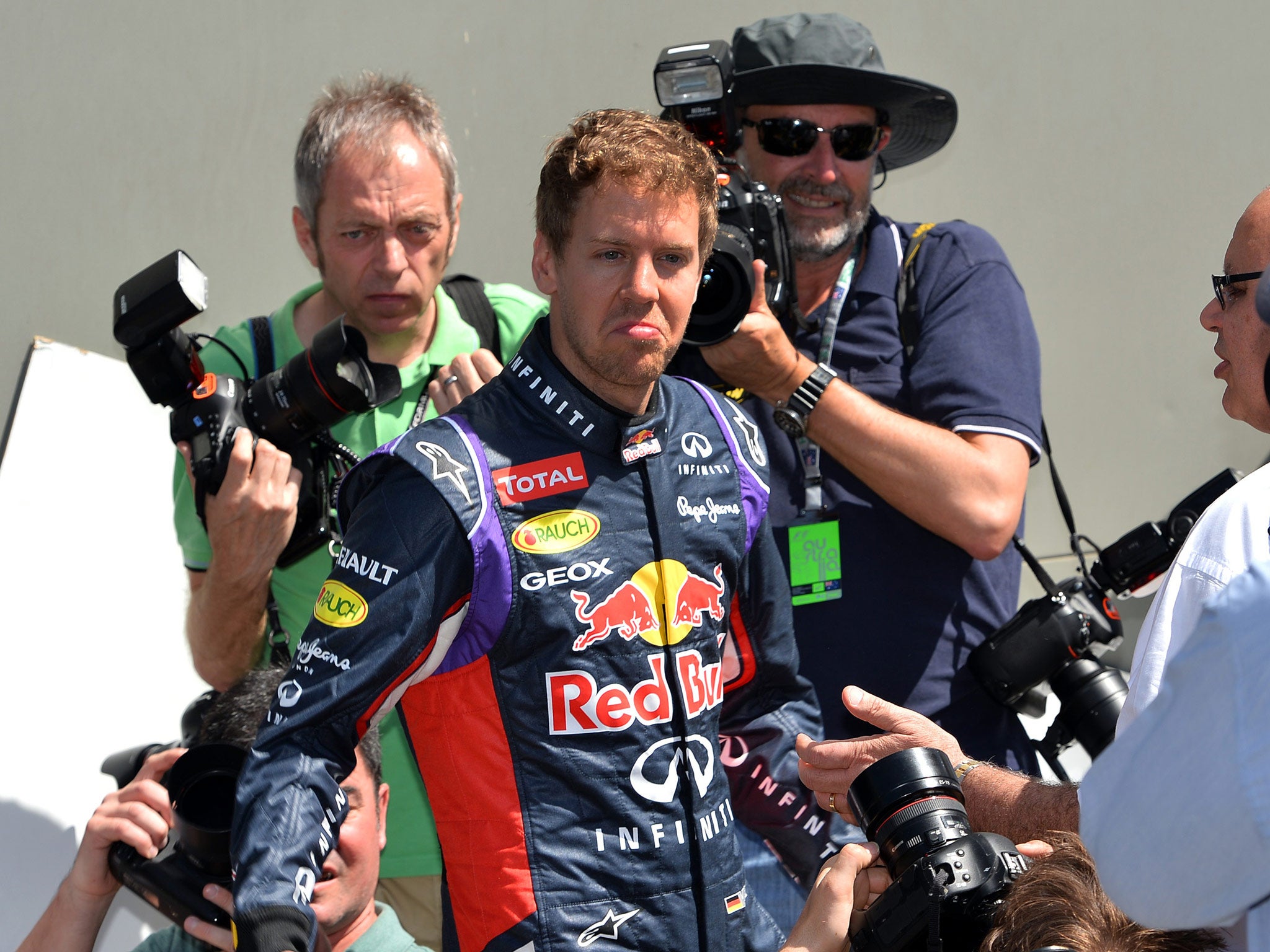 Red Bull driver Sebastien Vettel of Germany arrives for a photo shoot ahead of the Formula One Australian Grand Prix in Melbourne