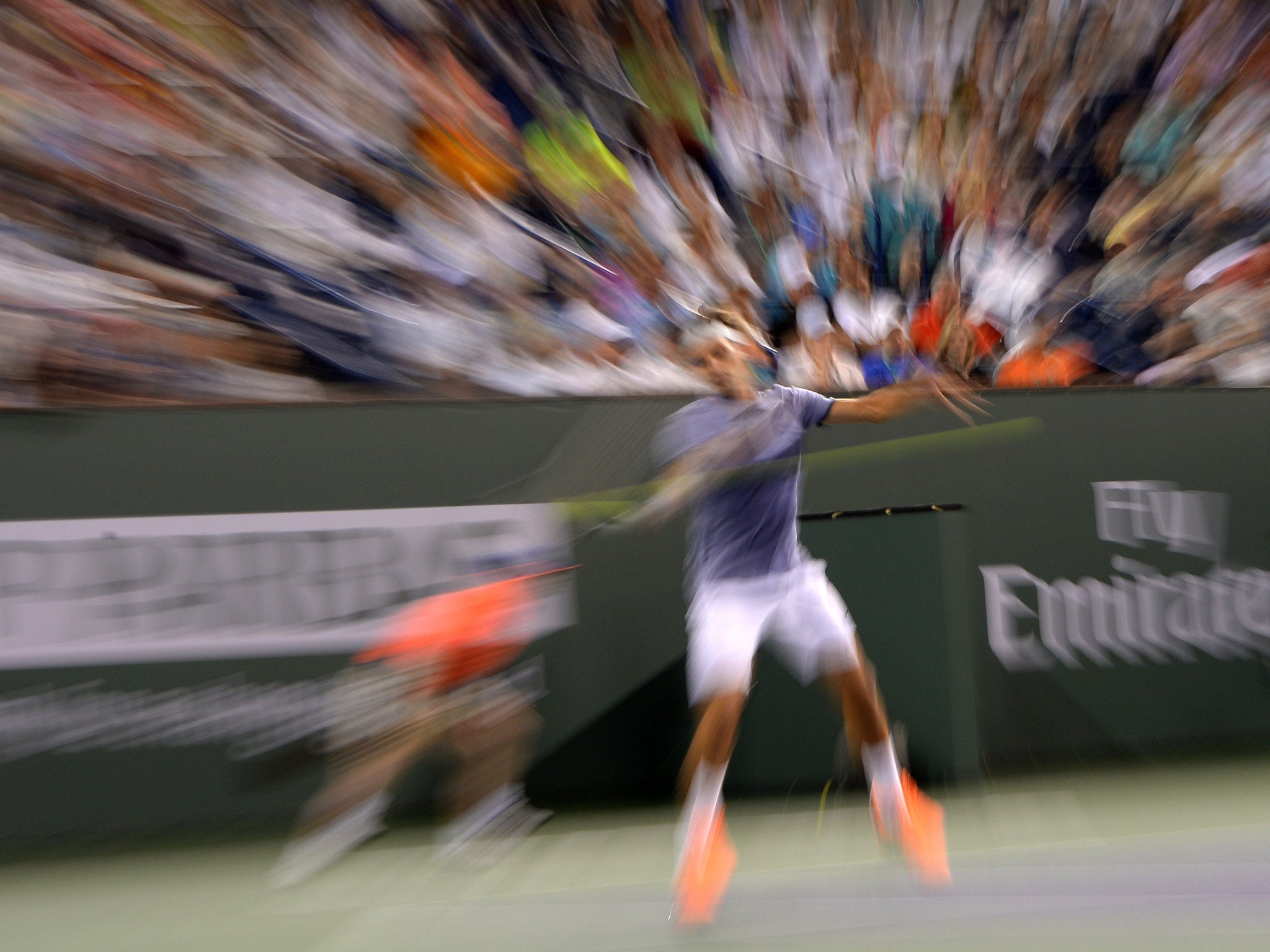 Switzerland's Roger Federer returns against Germany's Tommy Haas during the BNP Paribas Open at Indian Wells