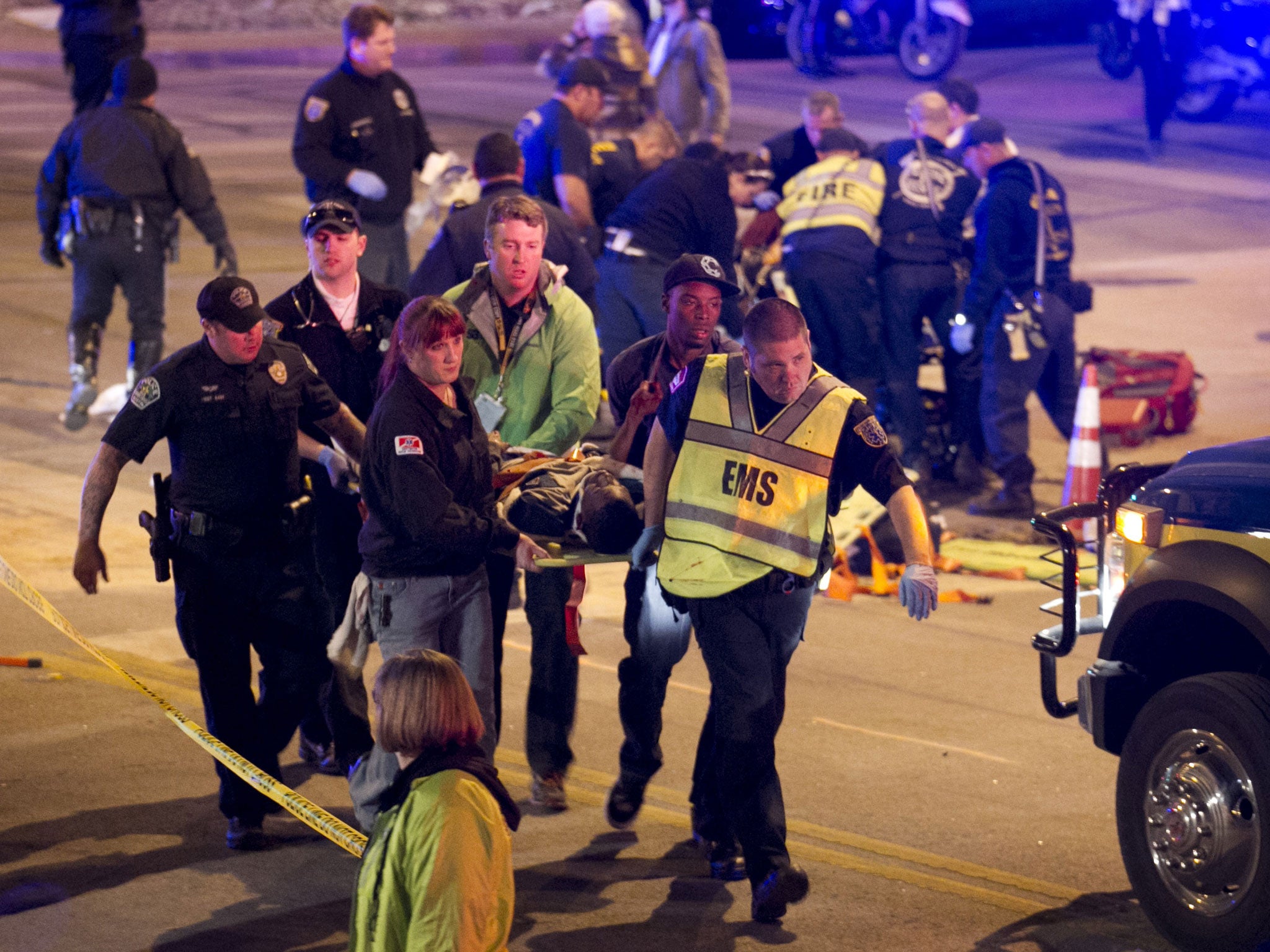 A patient is carried away after being struck by a vehicle on Red River Street in downtown Austin (Austin American-Statesman, Jay Janner)