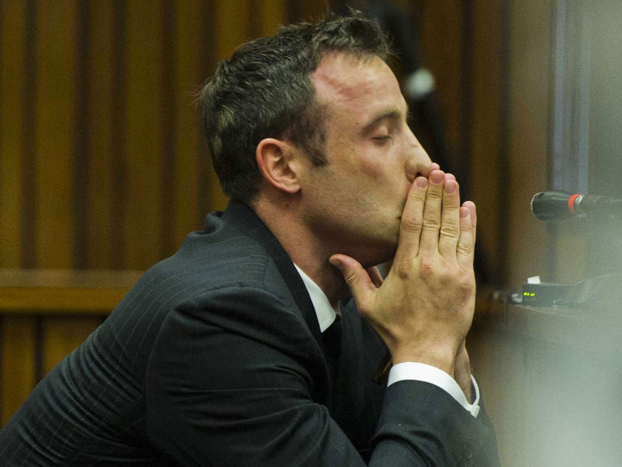 Oscar Pistorius sits in the dock during his murder trial at the North Gauteng High Court in Pretoria
