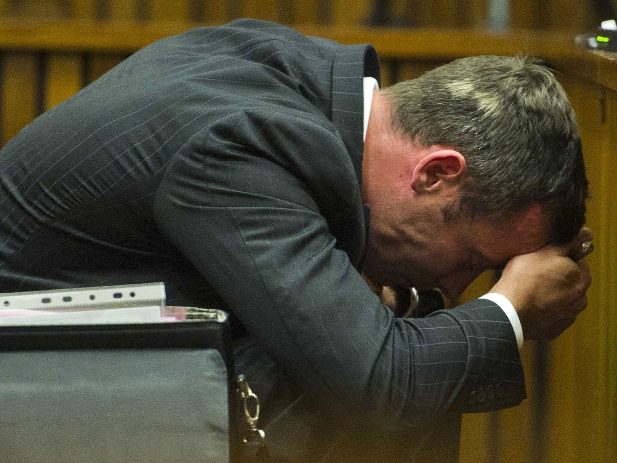 Oscar Pistorius reacts during his murder trial at the North Gauteng High Court in Pretoria
