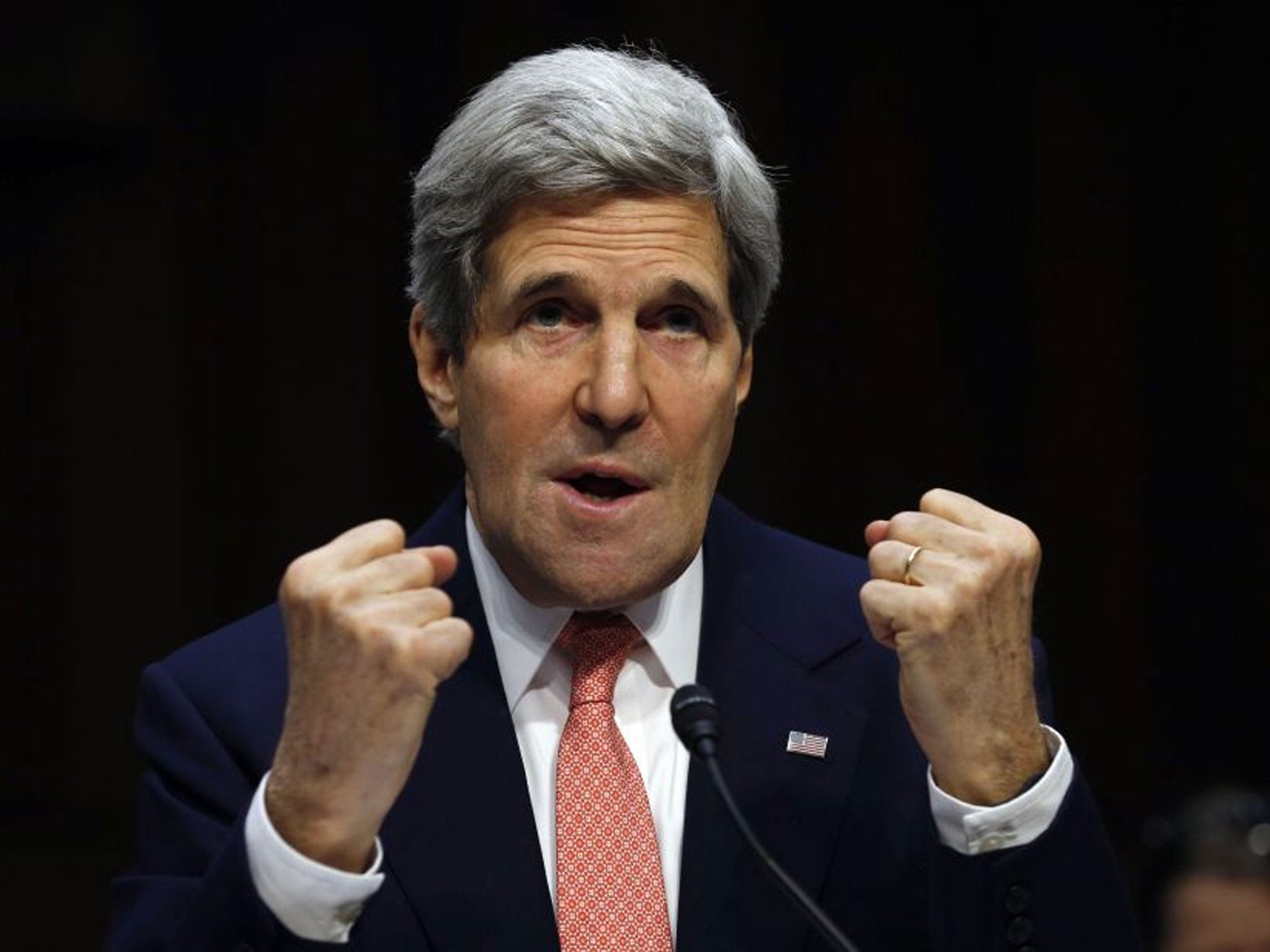U.S. Secretary of State John Kerry makes fists while speaking about the crisis in Ukraine during a hearing held by the Subcommittee on State, Foreign Operations, and Related Programs to examine proposed budget estimates for fiscal year 2015 for the Depart
