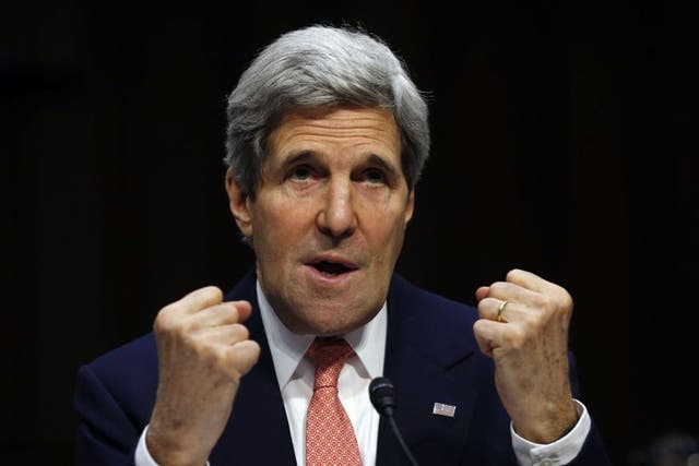 U.S. Secretary of State John Kerry makes fists while speaking about the crisis in Ukraine during a hearing held by the Subcommittee on State, Foreign Operations, and Related Programs to examine proposed budget estimates for fiscal year 2015 for the Department of State and Foreign Operations in Washington, March 13, 2014.
