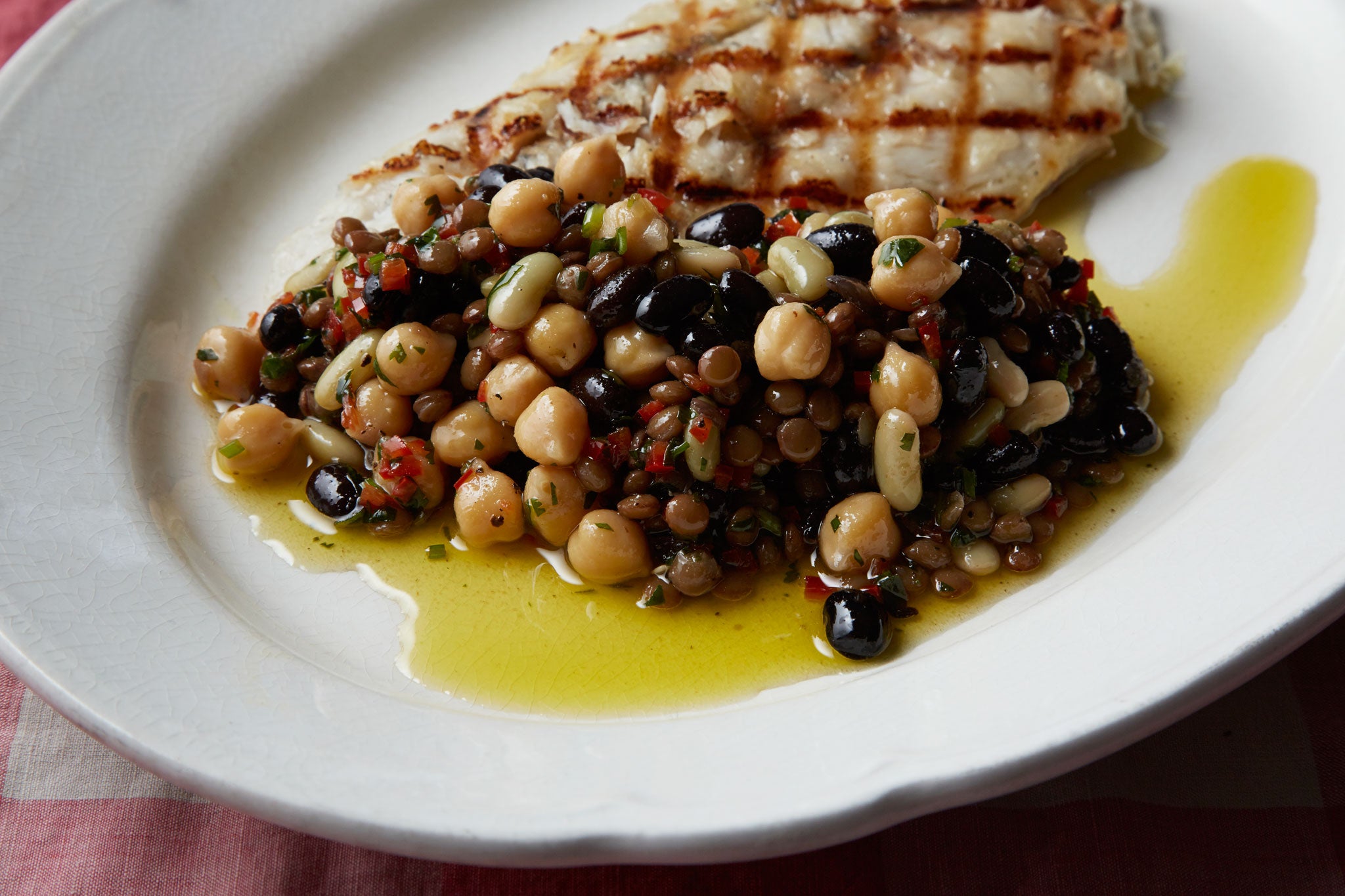 Mixed bean salad accompanying a fish dish