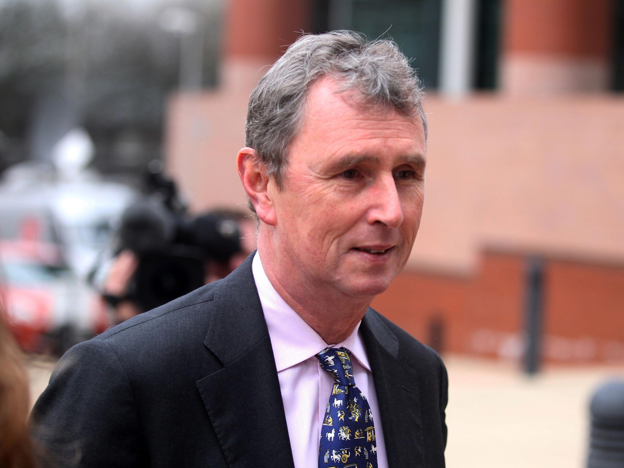 The former deputy speaker of the House of Commons Nigel Evans arrives at court