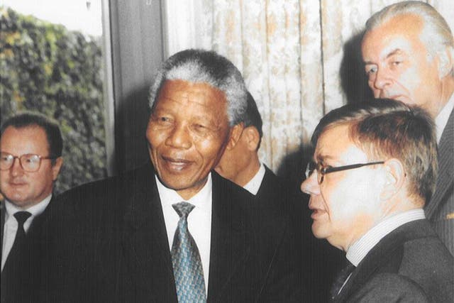 Peace keeper: Jean-Yves Ollivier, right, in 1995 with Nelson Mandela, with whom he forged a close relationship