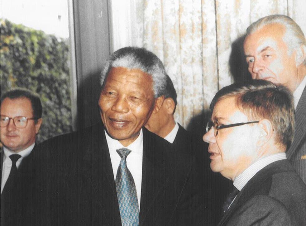 Peace keeper: Jean-Yves Ollivier, right, in 1995 with Nelson Mandela, with whom he forged a close relationship