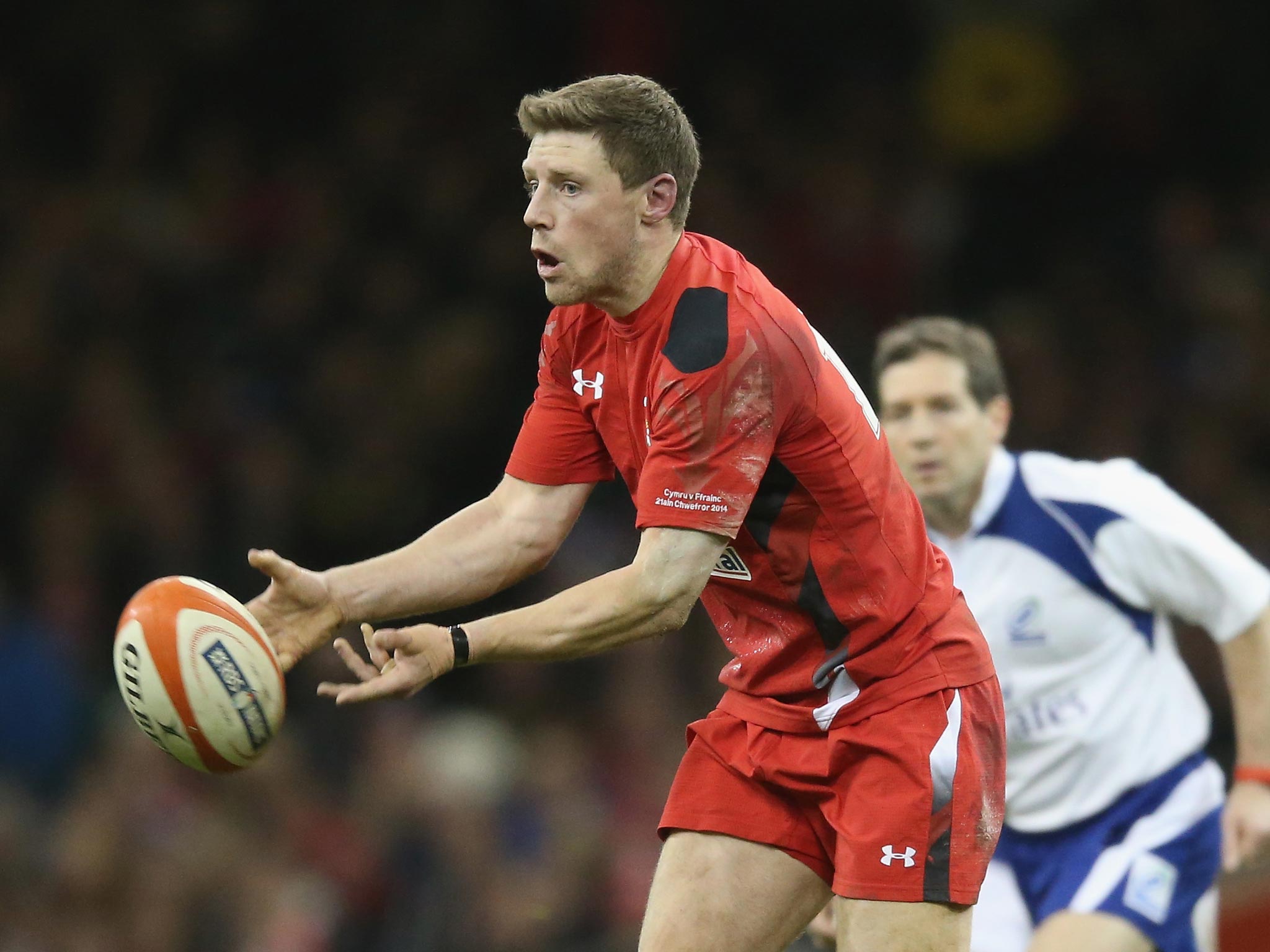 Rhys Priestland of Wales passes the ball 