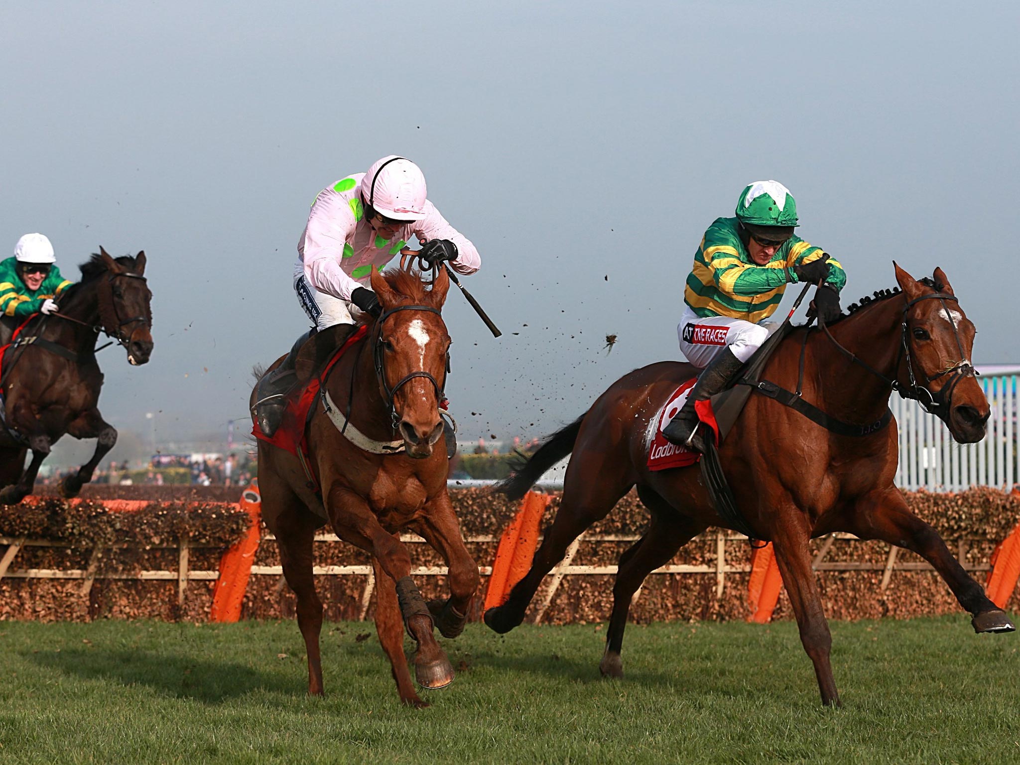More Of That ridden by Barry Geraghty (right) before winning the
Ladbrokes World Hurdle ahead of Annie Power ridden by Ruby Walsh
