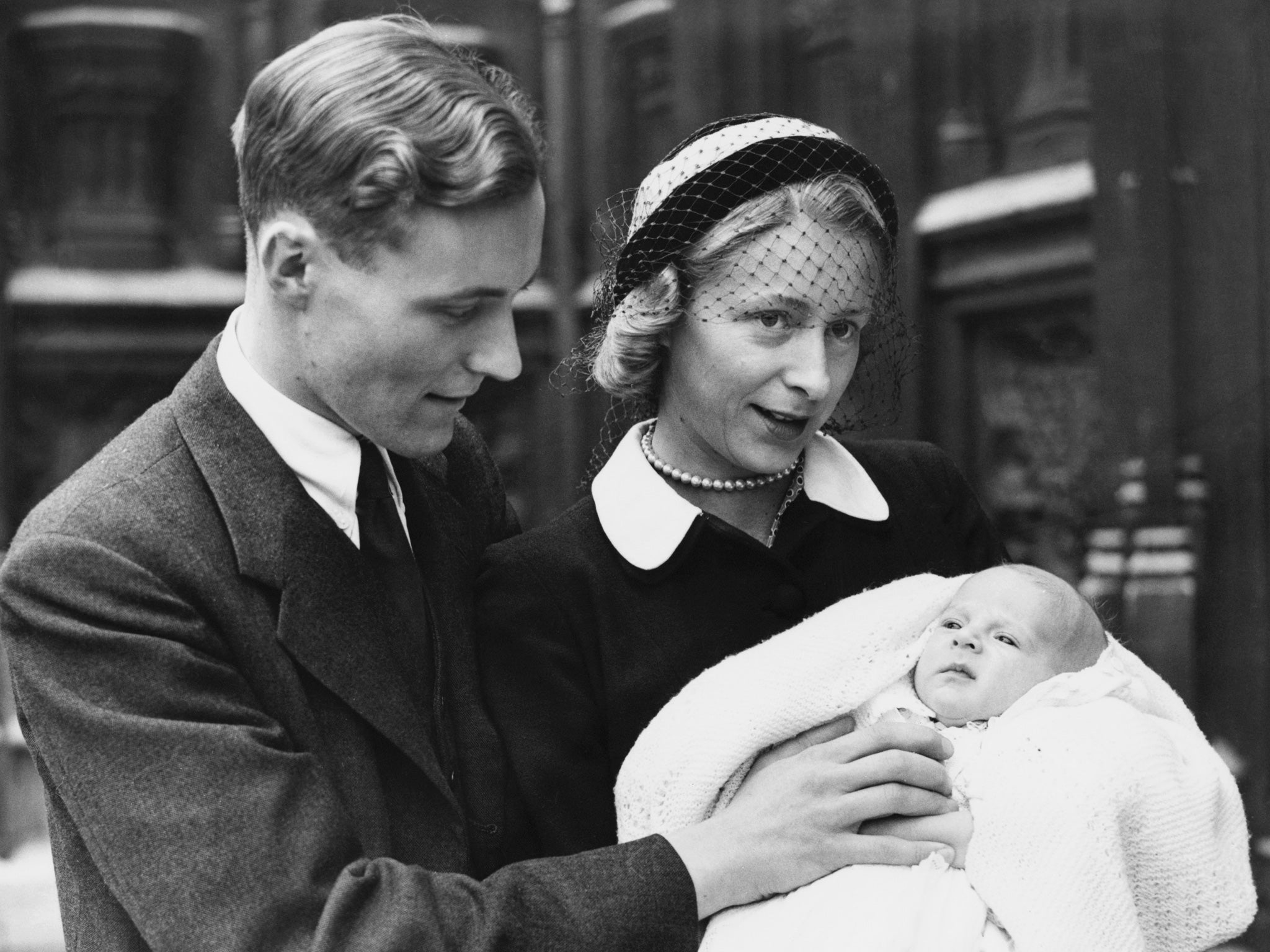 October 1951: Tony Benn with his wife, Caroline (1926 - 2000) and their son, Stephen, after his Christening at the House of Commons crypt