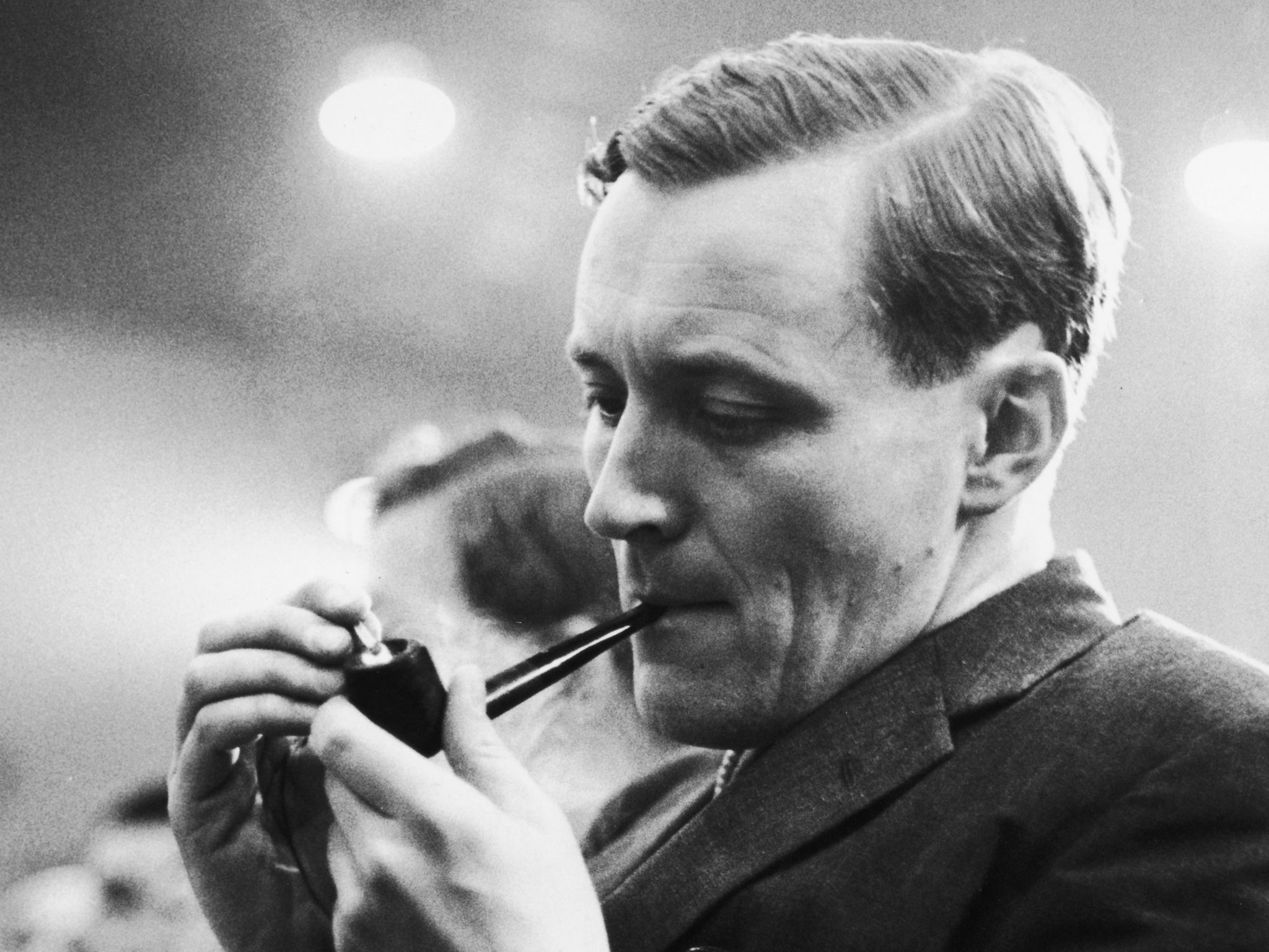 October 1962: Tony Benn lights his pipe during a speech at the Labour Party conference in Brighton