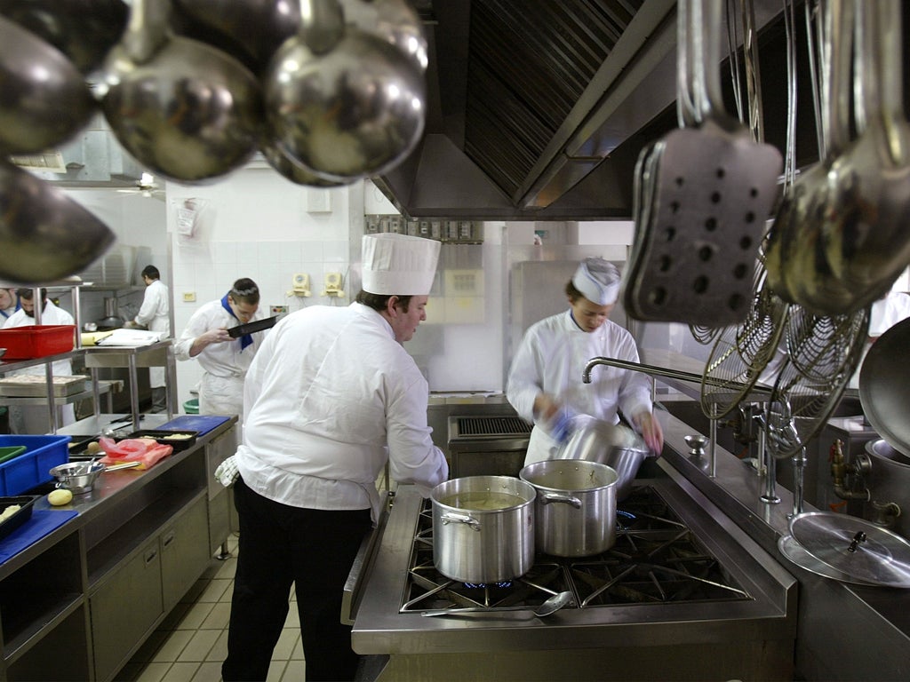 Chef Daniel Reicher (C), an instructor in the Kosher Culinary Academy, teaches in the kitchen with his Orthodox Jewish students March 4, 2004 in Jerusalem, Israel. The academy is the first cooking school in Israel catering to religious Jews, aiming to ful