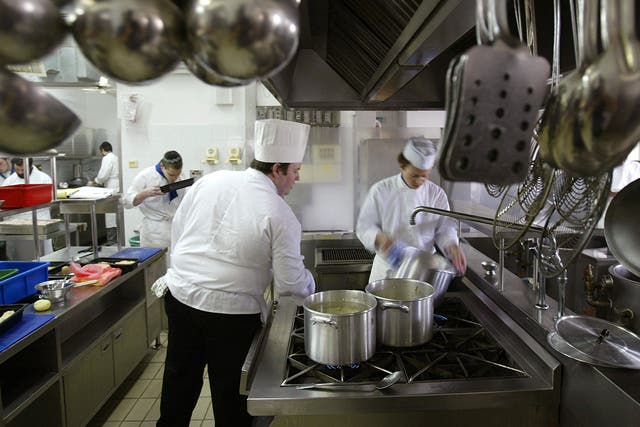 Chef Daniel Reicher (C), an instructor in the Kosher Culinary Academy, teaches in the kitchen with his Orthodox Jewish students March 4, 2004 in Jerusalem, Israel. The academy is the first cooking school in Israel catering to religious Jews, aiming to ful