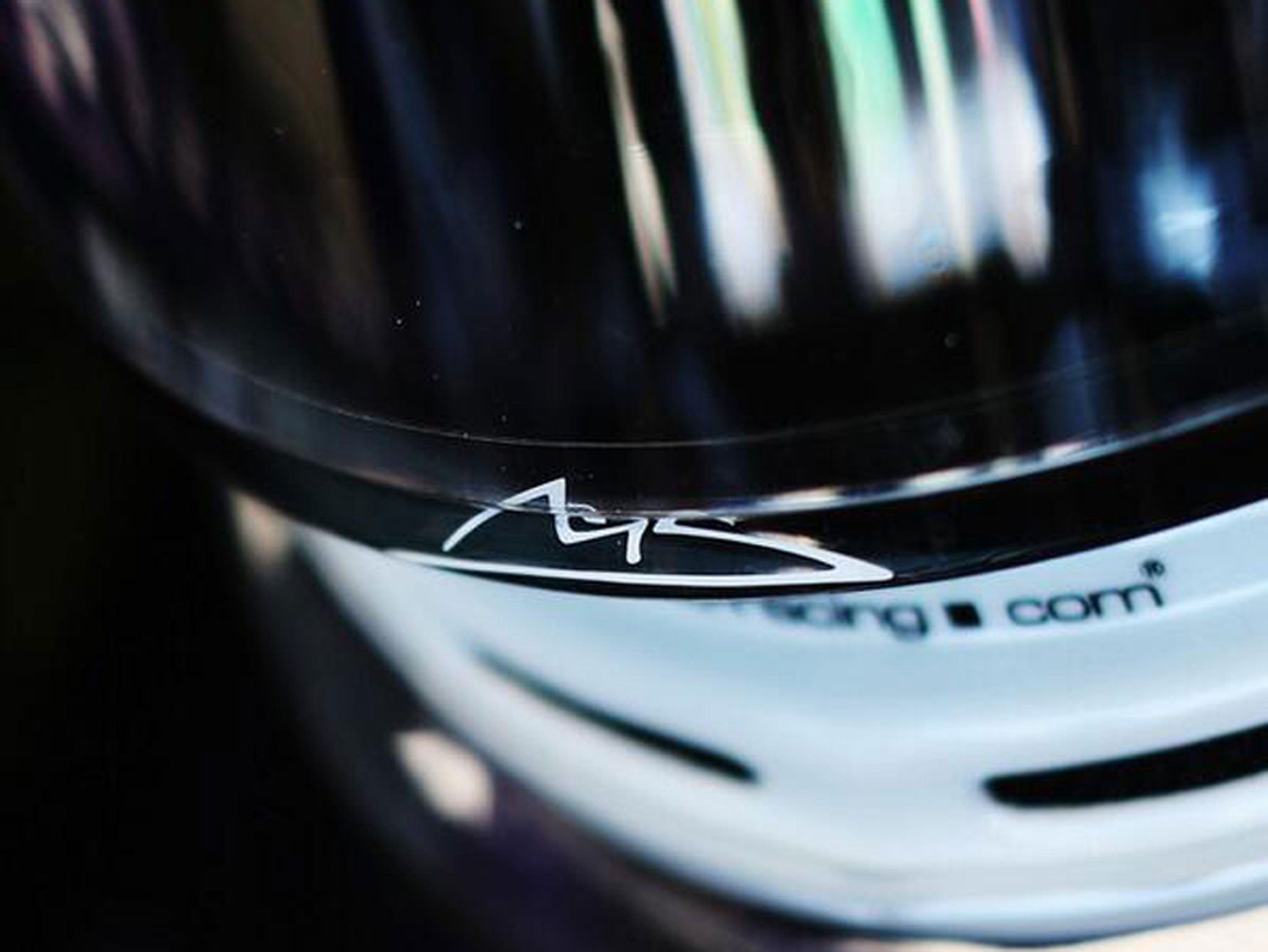 Sebastian Vettel pays tribute to Schumacher by putting his signature on the visor of his helmet