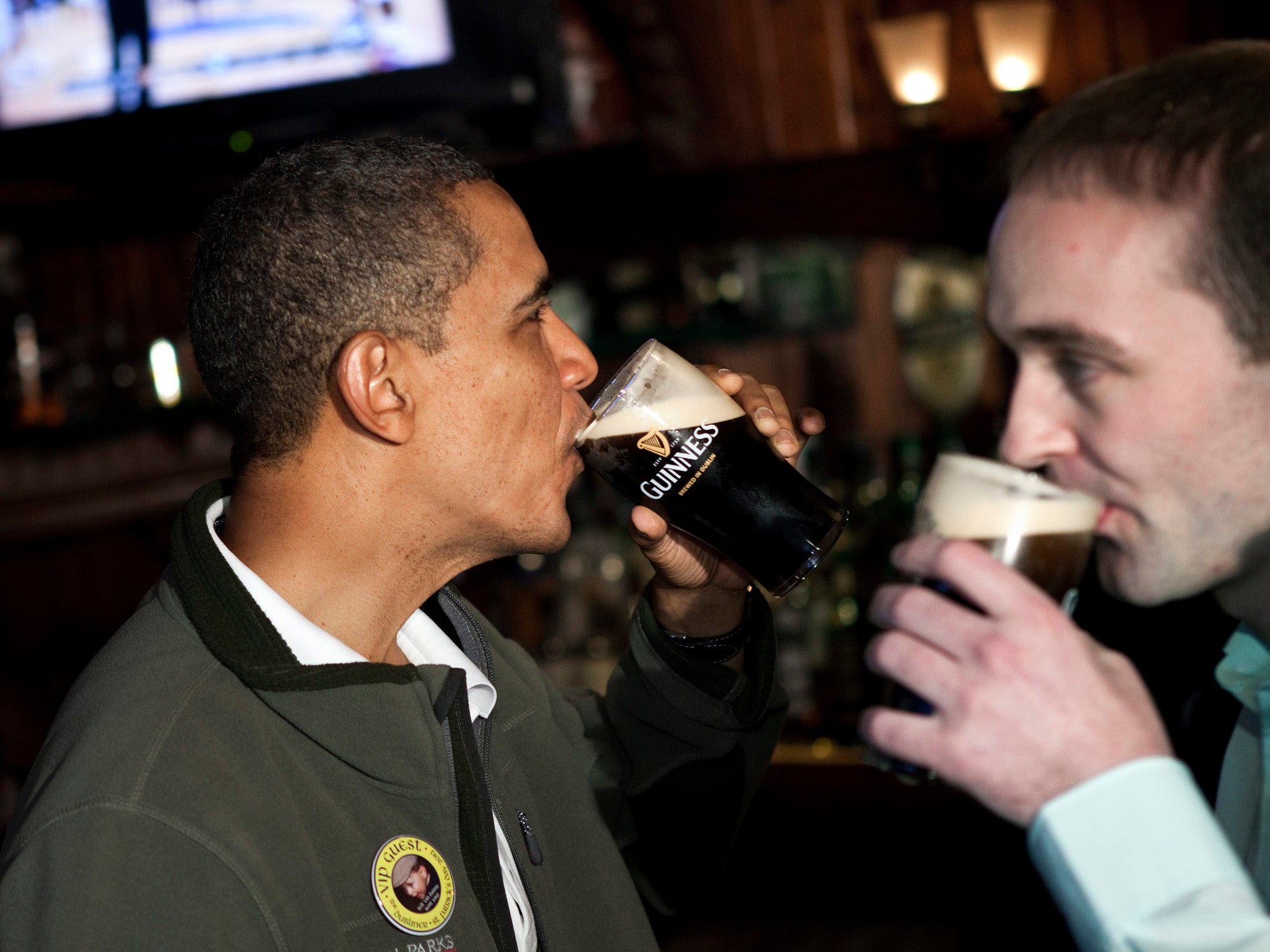 US President Barack Obama drinks a pint of Guinness with Henry Healy, an ancestral cousin of his from Moneygall, Ireland