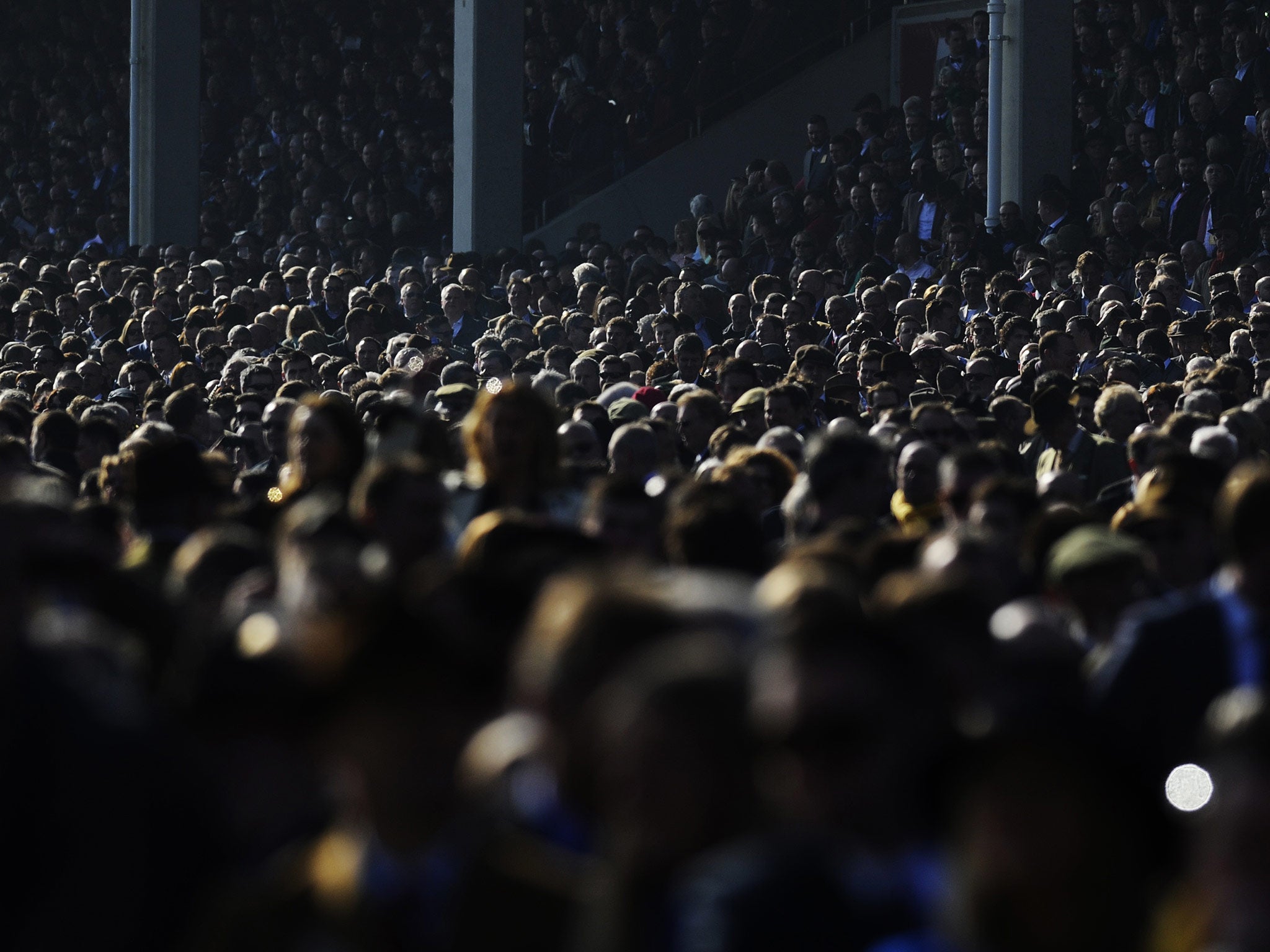 A sunny day as the crowd watch the action during Cheltenham Gold Cup day