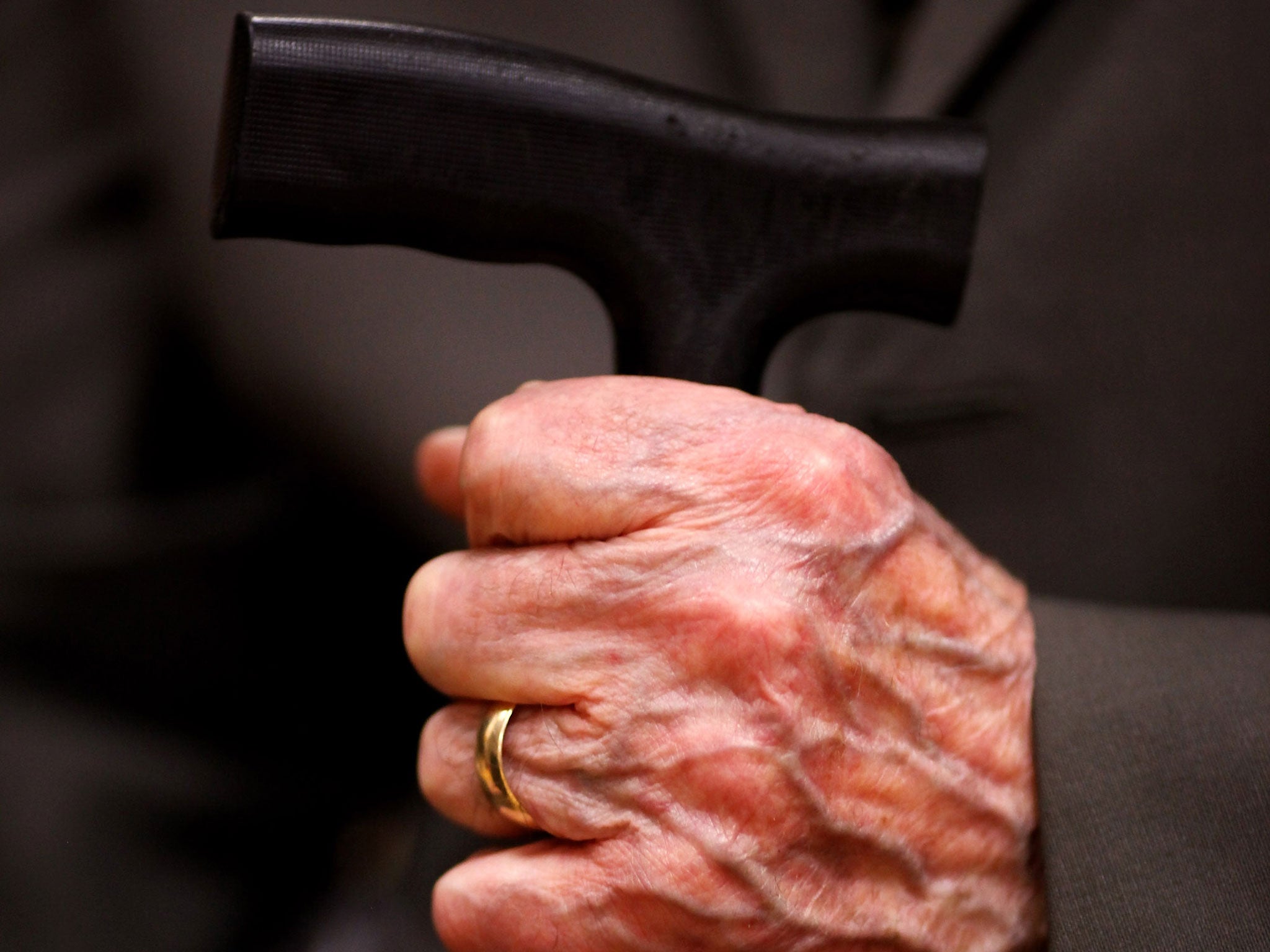 A senior citizen, unrelated to the incident in the US, holds his walking stick.