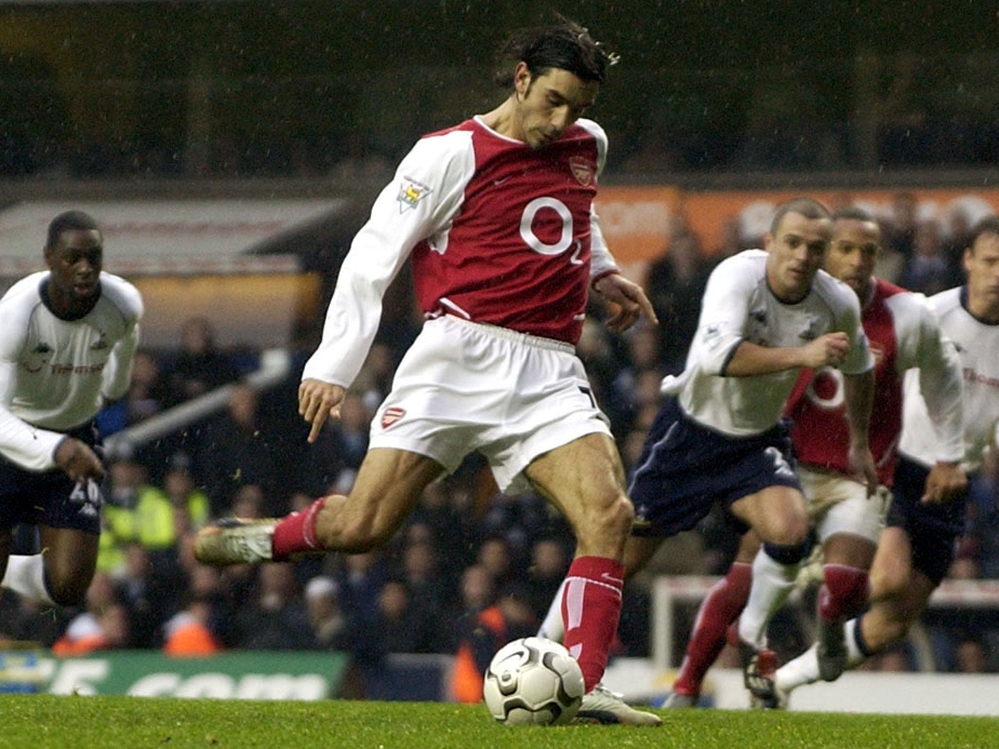Robert Pires scores from the penalty spot against Tottenham in December 2002